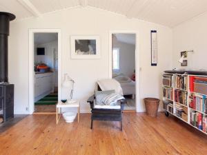 a room with a room with a bed and a table at Holiday Home Elisa - 600m from the sea by Interhome in Gedser