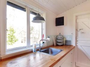 a kitchen with a sink and a window at Holiday Home Elisa - 600m from the sea by Interhome in Gedser