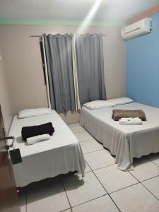 Кровать или кровати в номере Hotel Porto Amazônia