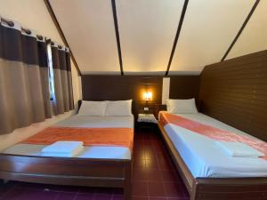 En eller flere senge i et værelse på Koh Yor Resort เกาะยอรีสอร์ท