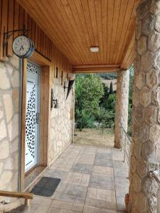 an entrance to a building with a clock on the wall at appartement lamia in Ifrane
