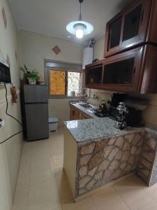 a kitchen with a sink and a counter top at appartement lamia in Ifrane