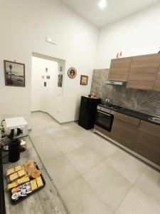 a kitchen with a plate of bread on the floor at Casetta la Bruna in Naples