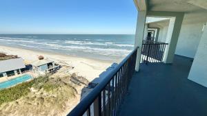 a balcony with a view of the beach at Top-floor ocean view condo with a private balcony and beachfront pool in Edgewater +38 photos