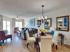 a living room with a couch and a table at Emerald Isle #106 in Pensacola Beach
