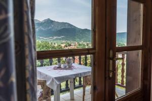 a table in a room with a view of a mountain at Acro Studios in Skala Potamias
