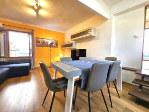 a dining room with a blue table and chairs at Casa Olivazzo in Chiusi