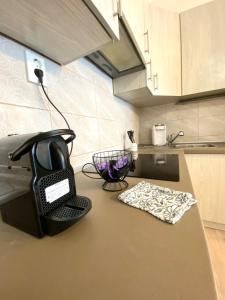 a black phone on a counter in a kitchen at BartokLux in Budapest +10 photos