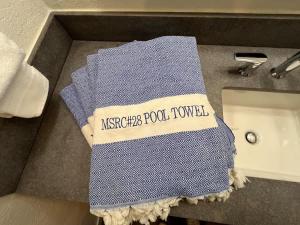 a towel that is sitting on top of a sink at Tastefully Remodeled Condo at Mammoth Ski & Racquet Club, Hot Tub, Garage, 10 Min Walk to Ski Lifts in Mammoth Lakes