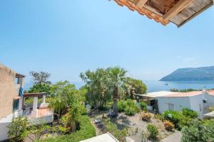 a view of the ocean from a house at JERA Holiday Collection VULCANO TRE - Sea View in Vulcano +44 photos