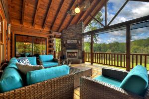 a screened in porch with furniture and a fireplace at Lady of the Lake in Santaluca