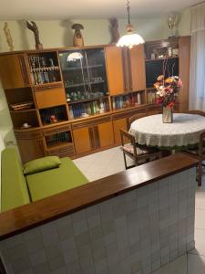 a kitchen with a table and a dining room at Casa Marianna in Marseiller +10 photos