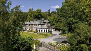 an aerial view of a large house with trees at Merewood Country House Hotel in Windermere