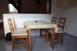 a table with two chairs and a table cloth on it at Ferienwohnung Prenzlau in Prenzlau