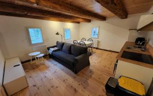 a living room with a couch and a table at Vierseithof "Waitzdorfer Hof" in Hohnstein