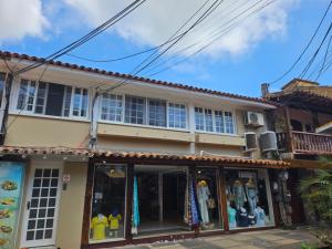a store front of a house with clothes in it at Apart Coração de Búzios in Búzios