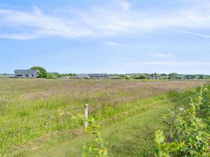a fence in the middle of a field at Holiday Home Fentje - 200m from the sea by Interhome in Frørup +21 photos