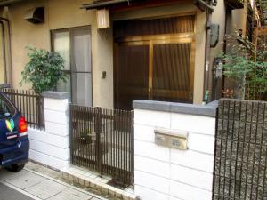 a house with a fence in front of a door at Uji - House - Vacation STAY 9753 in Uji +8 photos