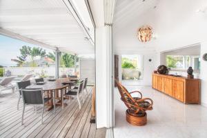 a dining room and kitchen with a table and chairs at Villa Mangorient 3 bd private pool in Orient Bay in Orient Bay