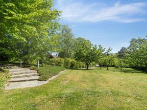 a park with stairs and trees and grass at Holiday Home Nantje - 560m to the inlet by Interhome in Jægerspris