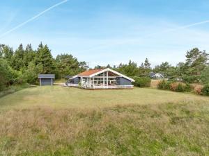 a house on a large grassy field at Holiday Home Eltje - 4km from the sea by Interhome in Blåvand