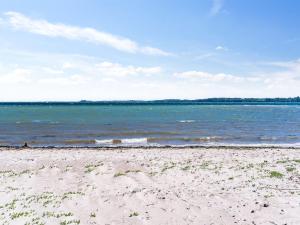 a sandy beach with the ocean in the background at Holiday Home Fokke - 450m from the sea by Interhome in Aabenraa