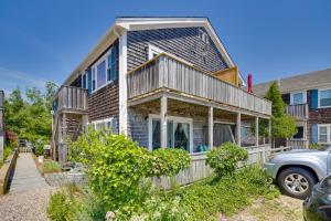 a house with a car parked in front of it at Pool and Beach Access Coastal Condo in Provincetown in Provincetown