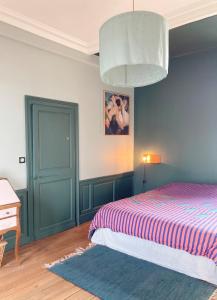 Ένα ή περισσότερα κρεβάτια σε δωμάτιο στο Villa Rosamonde, Fécamp Beachfront