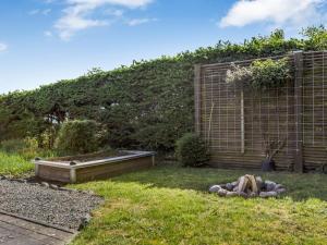 a garden with a raised bed in the grass at Holiday Home Jelke - 500m from the sea by Interhome in Aabenraa