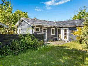 a home with a gray house with a yard at Holiday Home Waltraud - 50m from the sea by Interhome in Yderby +29 photos