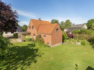 an aerial view of a brick house with a yard at Holiday Home Sakulf - 500m from the sea by Interhome in Sæby