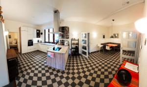 a large kitchen with a checkered floor at Ferienwohnung Villa 16F in Pirna