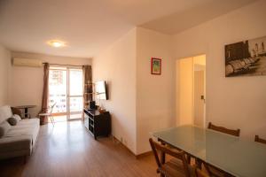 a living room with a table and a couch at SUH Copacabana 120 Premium Flat in Rio de Janeiro