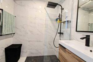 a bathroom with a shower and a sink at Studio with sea view in Orcino +8 photos