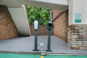 a parking meter in front of a building with a door at Best Western Acworth Inn in Acworth