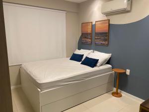 Ένα ή περισσότερα κρεβάτια σε δωμάτιο στο Lindo Apartamento em Guarajuba Proximo a Praia +16 φωτογραφίες