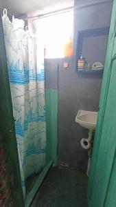 a bathroom with a sink and a shower curtain at Pelourinho House Experience in Salvador +22 photos