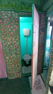 a bathroom with a toilet in a room with water at Pelourinho House Experience in Salvador