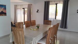 a dining room with a table with chairs and a table and chairsktop at West Coast Dream in Mauritius