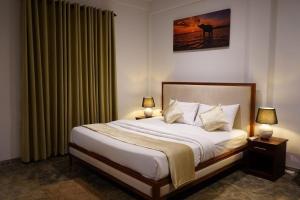 Katil atau katil-katil dalam bilik di Galle Beach Villa