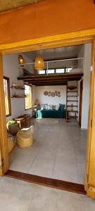 a large room with a bed and a loft at Vila Prana - Chalé Paz - privacidade e vista infinita in Alto Paraíso de Goiás