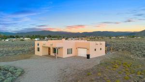 an aerial view of a house in the desert at New Home, Big Views, Hot Tub, Gazebo! - Casa del Sol in Ranchos de Taos
