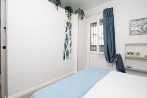 a bedroom with a bed and a window at Villa Mirella - Luxury in the center of Tuscany in Empoli