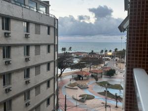 a view of the ocean from a building at Areia Flat vista mar piscina e ar in Guarapari