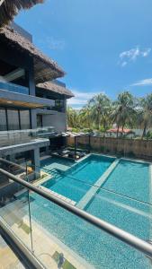 a swimming pool in front of a house at Cardedeu Residence Cangrejera in La Libertad +5 photos