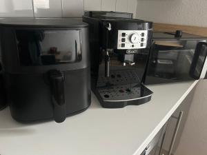 a microwave and a coffee maker on a counter at 2-3 Personen Apartment mit Bergblick in Landeck +5 photos