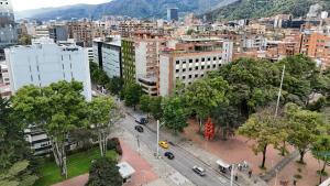an aerial view of a city with buildings and a street at Cité Hotel in Bogotá