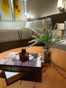 a living room with a couch and a coffee table at Novotel Residence Manila Hotel by Jolly Luxe Suites in Manila