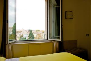 Postel nebo postele na pokoji v ubytování Ibis Styles Parma Toscanini