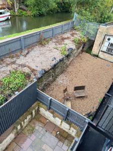 an aerial view of a yard with a fence at 3 Bedroom House with free on site Parking next to the Canal in Keighley